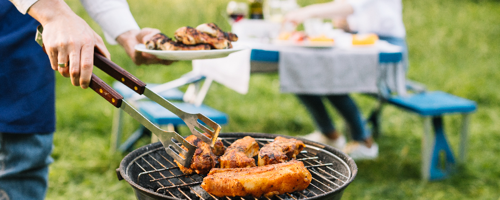 Grill with meat being cooked