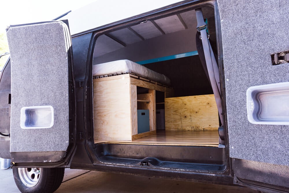 storage space beneath a bed in a camper van