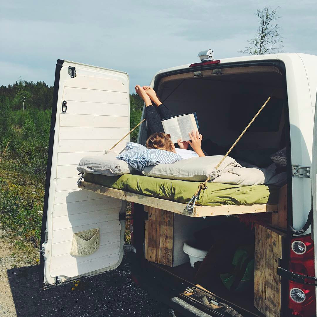 diy platform bed design in a camper conversion for living in a van