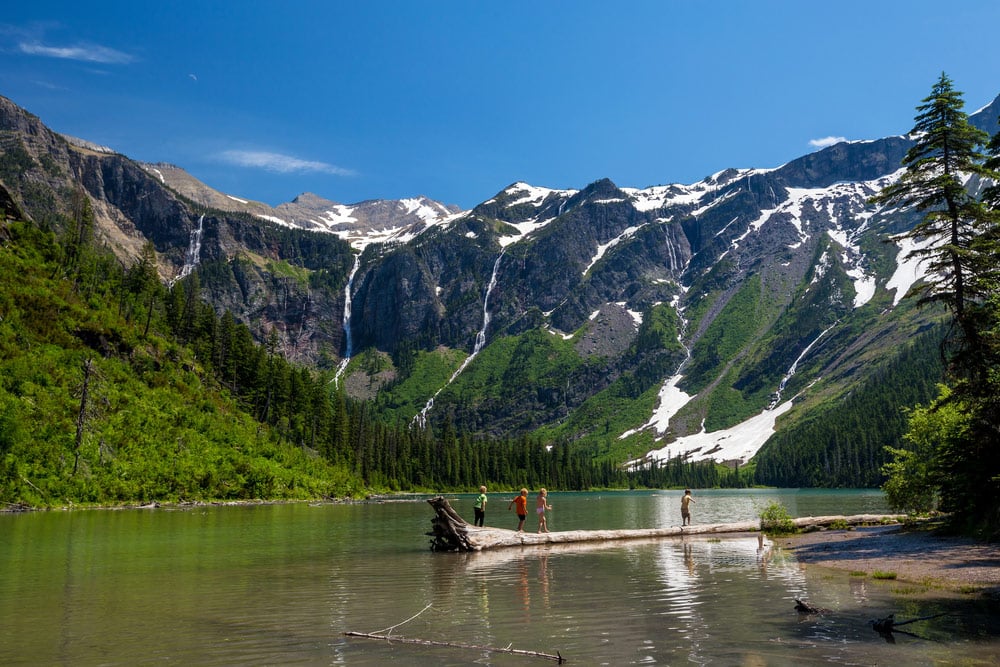 kids playing in avalanche lake glacier national park montana