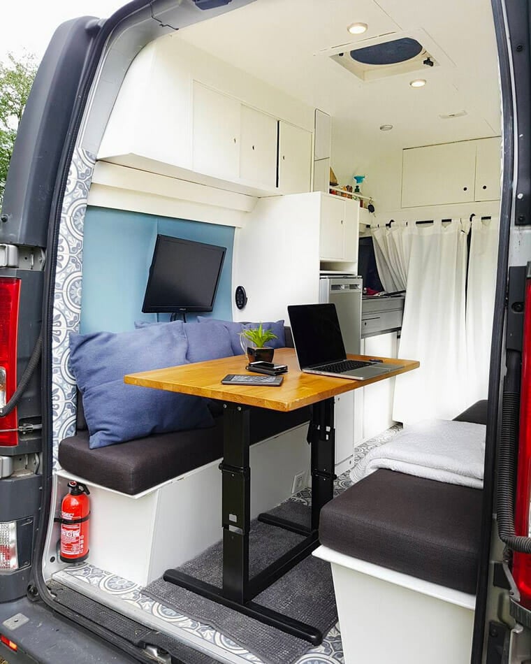 digital nomad working on the road in a camper van