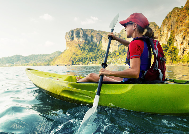 kayak through blue water on an adventure