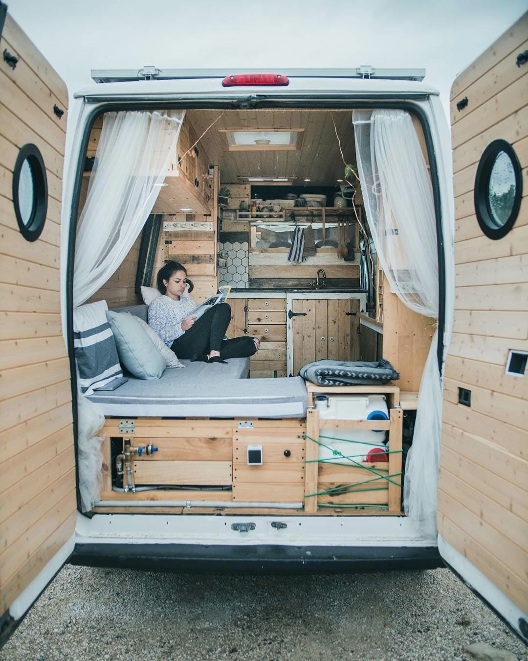 sitting in a custom campervan conversion build