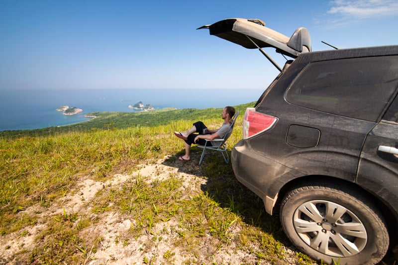 car camping in the back of an SUV hatchback