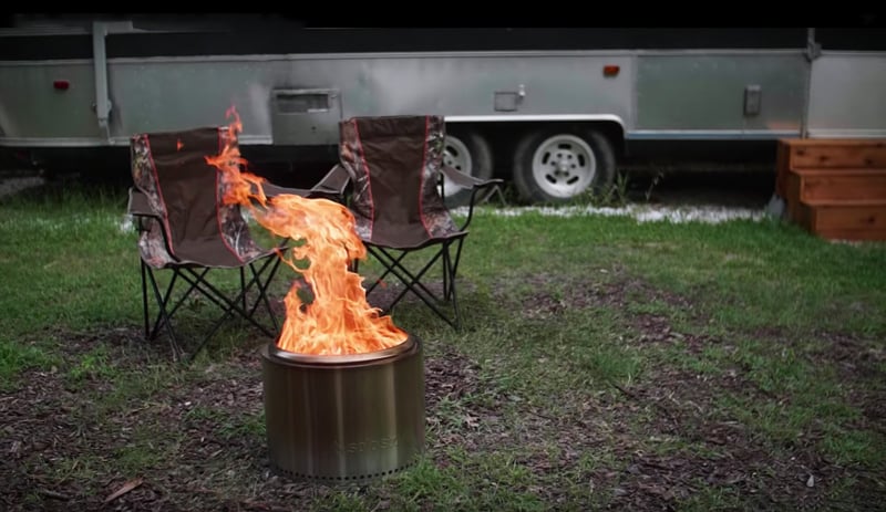 RV camping next to a portable fire pit