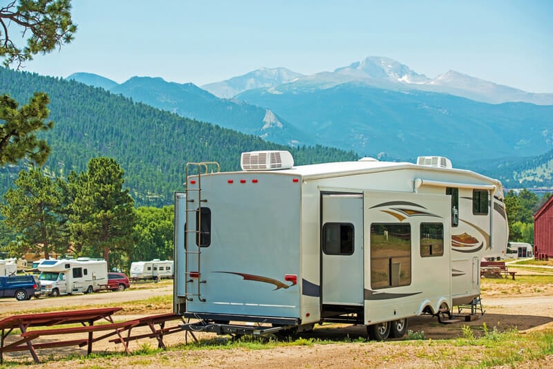 5th wheel trailer parked at a campground