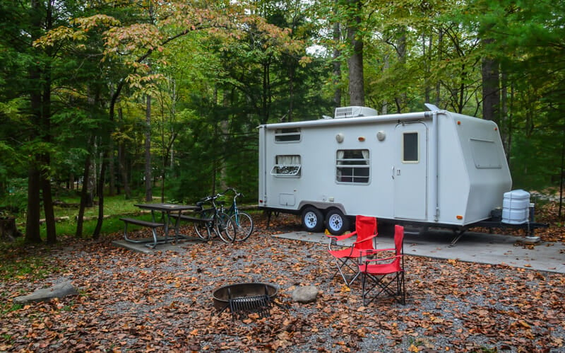 performing rv maintenance on a camping trip