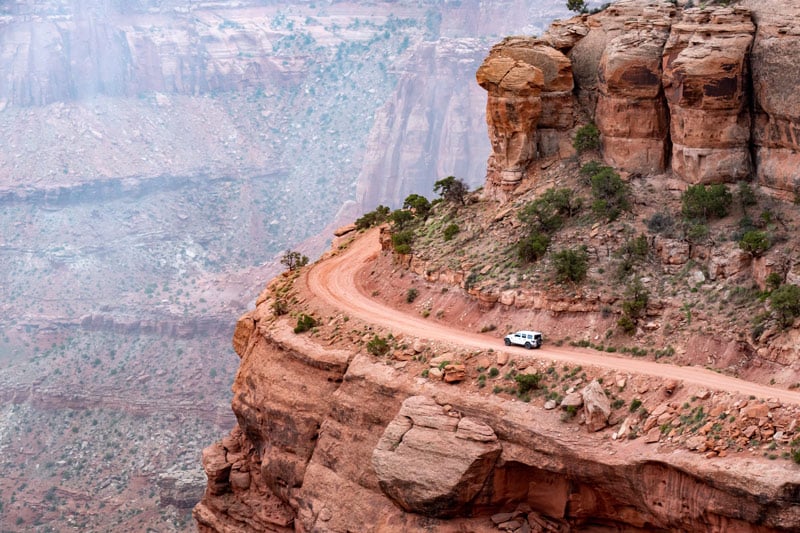 jeeping and overlanding on a cliff in canyonlands national park utah