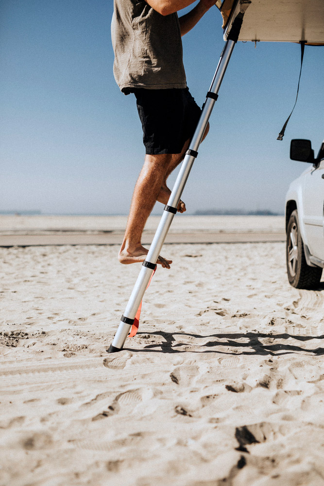 climbing an rv camper van telescoping ladder