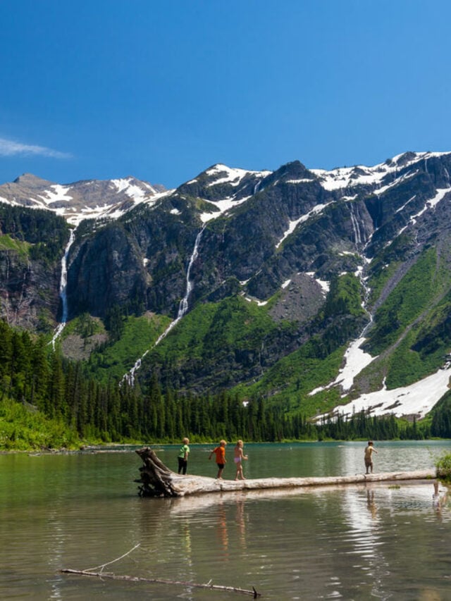 kids playing in avalanche lake glacier national park montana