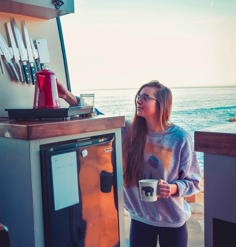 cooking food while camping in a diy camper kitchen