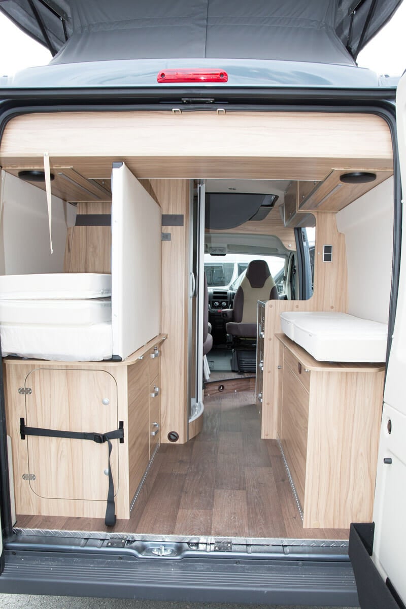 drawbridge style convertible bed in a campervan conversion