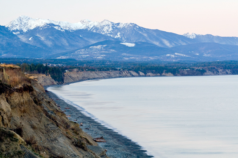 view of dungeness spit and the mountains in olympic national park washington