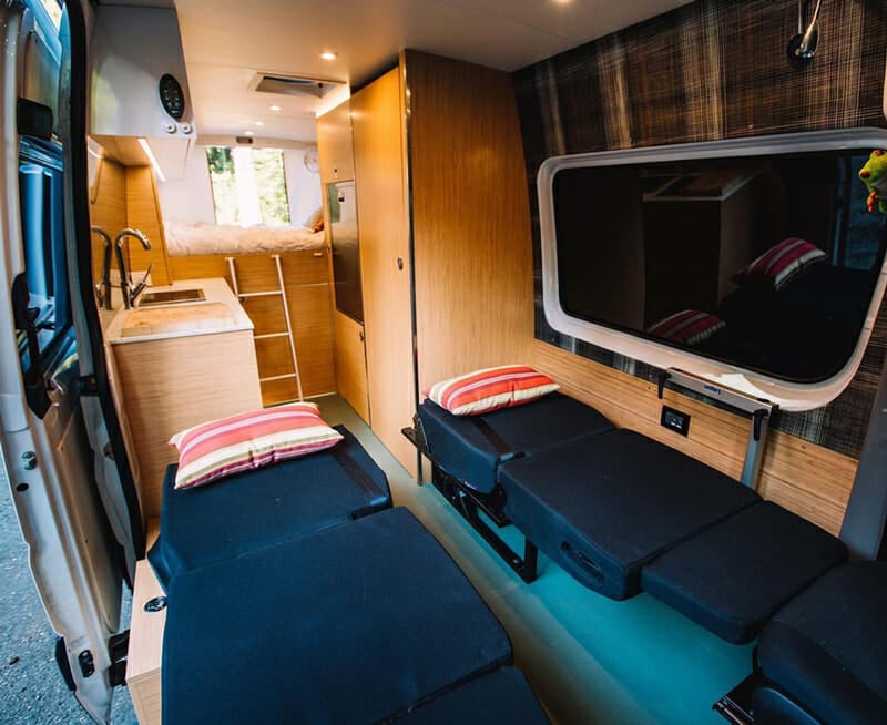bench seat that folds down into a bed in a camper van