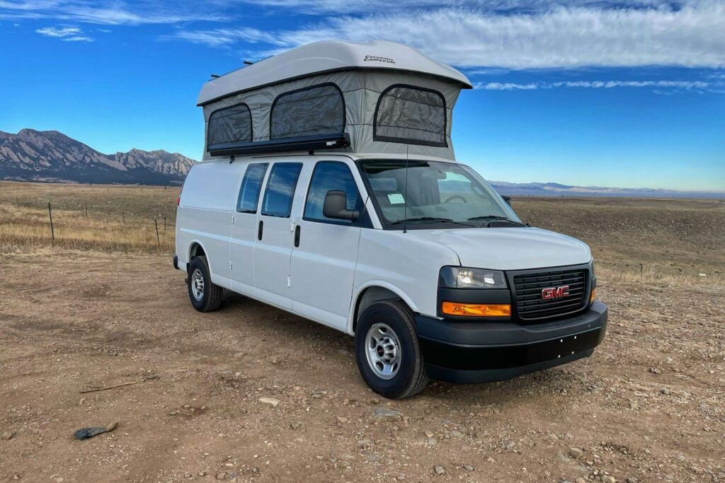 van life in a GMC savana built by <a href="https://www.contravans.com/gmc-savana-campervan">Contravans</a>