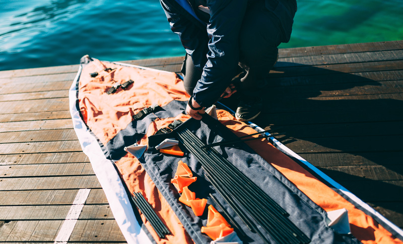 blow up an inflatable kayak to paddle down a river