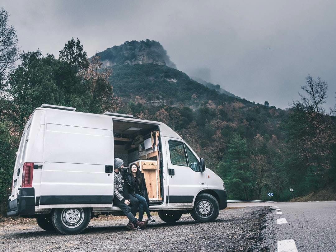 #vanlife couple living in a campervan conversion