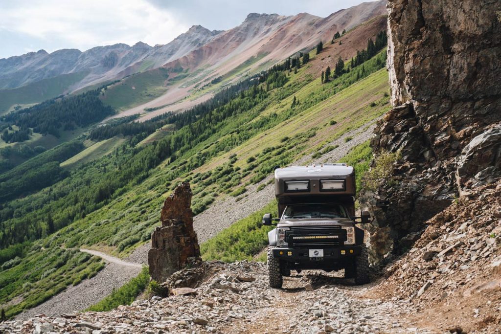 driving a luxury expedition vehicle off road while overlanding