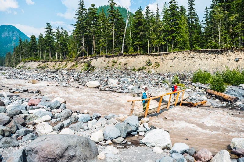 crossing the nisqually river in mount rainier national park washington