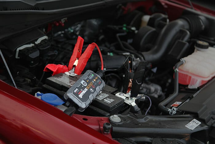 portable jump starter in a pickup truck