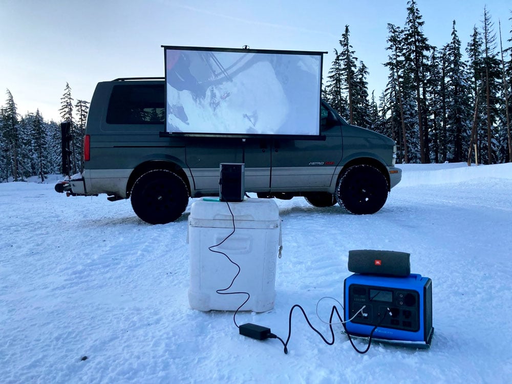 playing movies on a projector screen using a solar powered generator