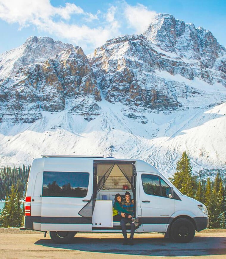 adventuring van couple in the mountains