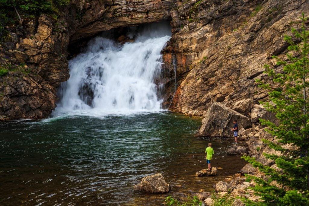 fishing next to running eagle falls glacier national park