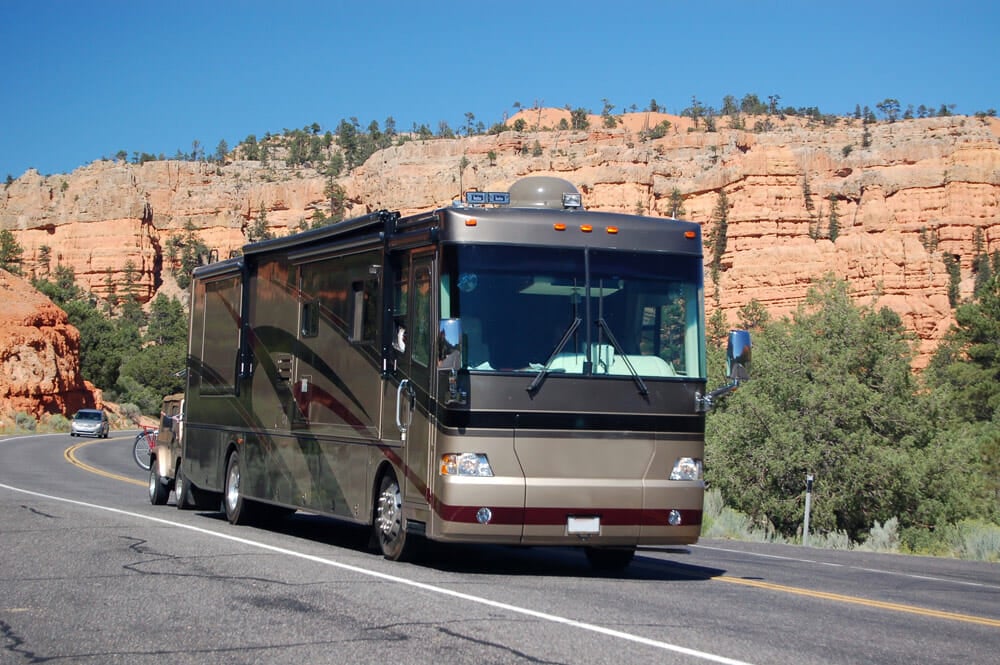 Large class A motorhome driving on a rural road