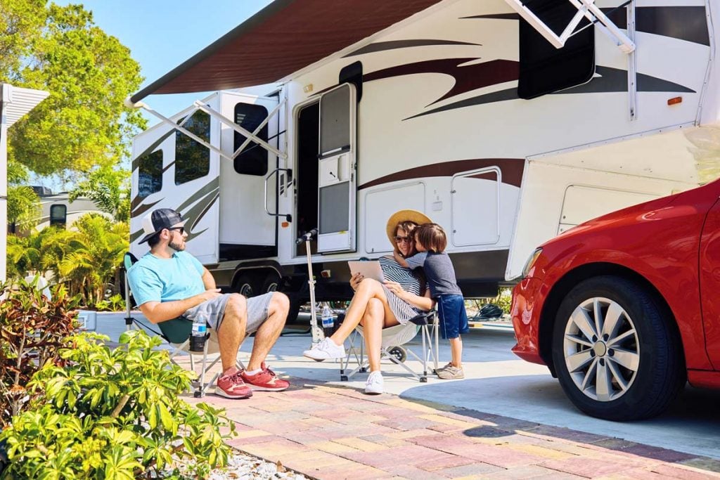 family rv camping at a koa campground