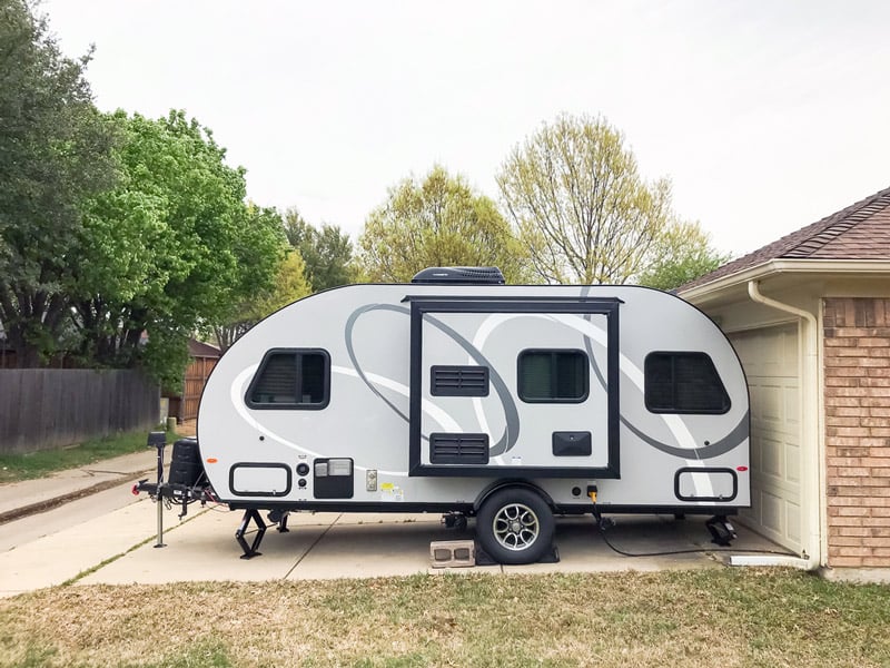 travel trailer parking in a driveway at a boondockers welcome host location