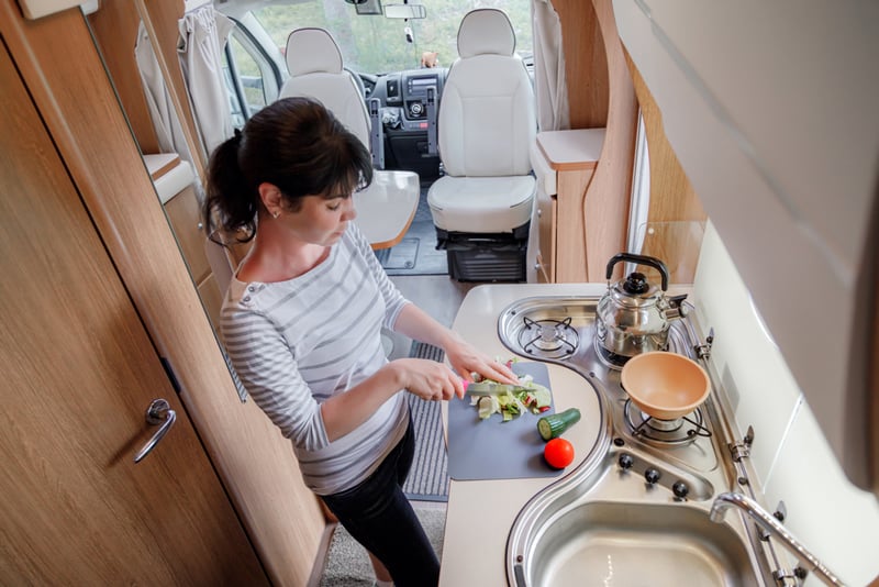 cooking vegetables in an rv next to the kitchen sink