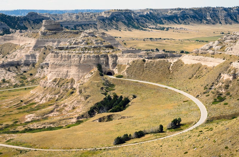 long road driving to scotts bluff national park in nebraska