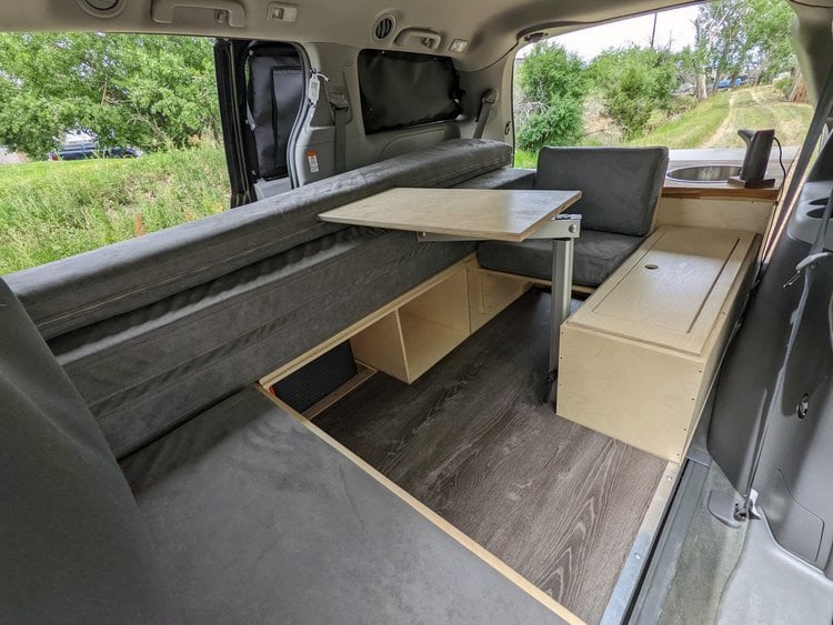 seating and interior desk space in a toyota sienna camper