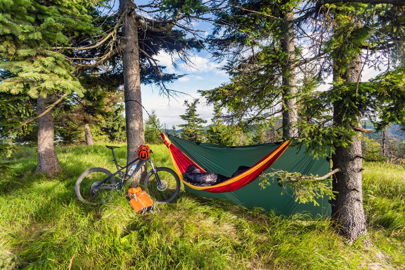 sleeping underneath a shade covered hammock tarp