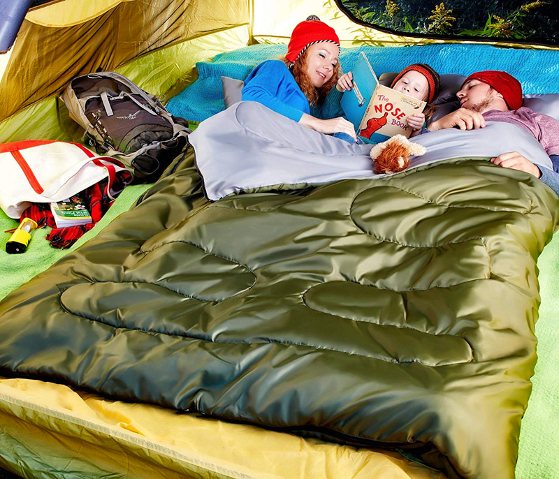 family staying warm in a tent while camping with an extra large double wide sleeping bag