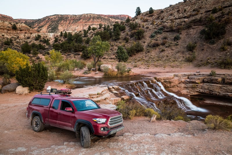 truck camping in the back of a 4x4 suburban