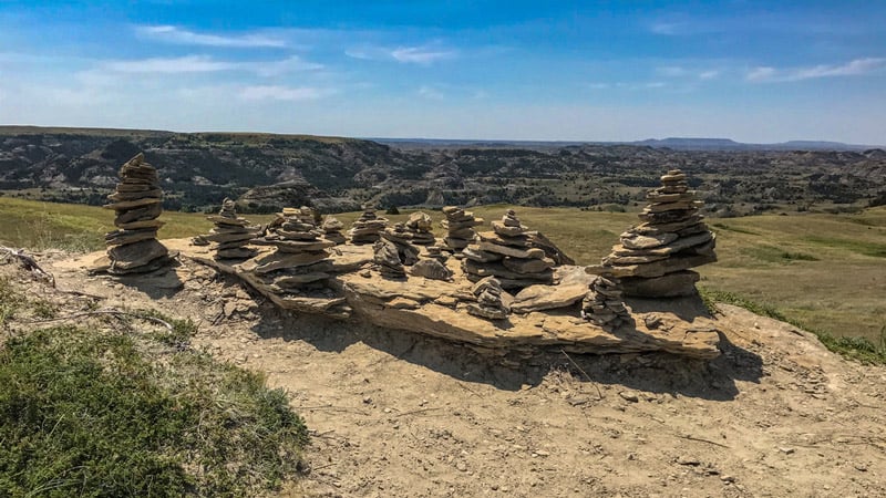 cairns on a hiking trail at theodore roosevelt national park in north dakota