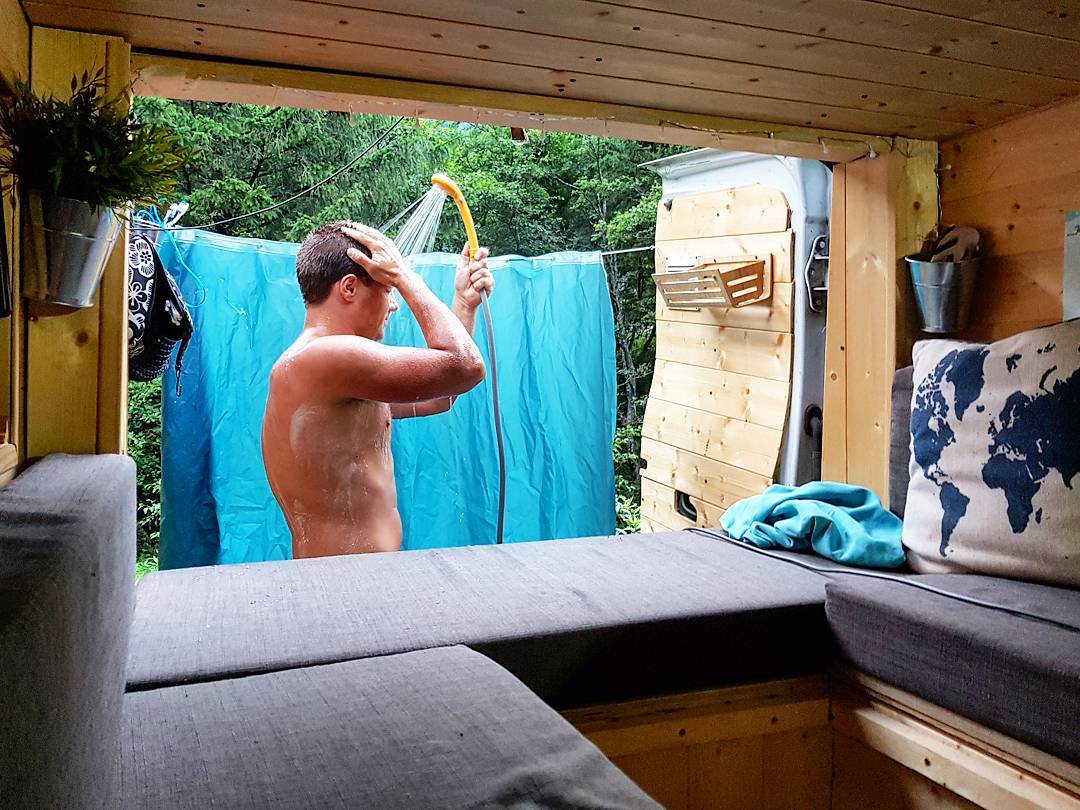 Showering in the back of a campervan conversion with a 12 volt water heater
