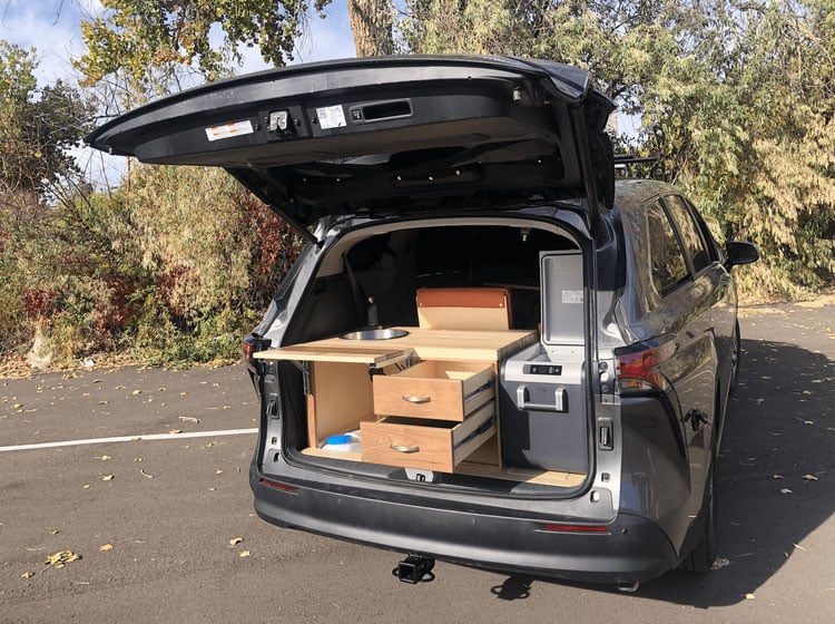 toyota sienna xle camper van conversion with drawers and refrigerator in the back