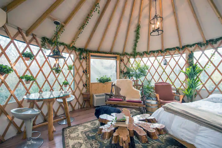 a treehouse created from an elevated yurt in florida for glamping