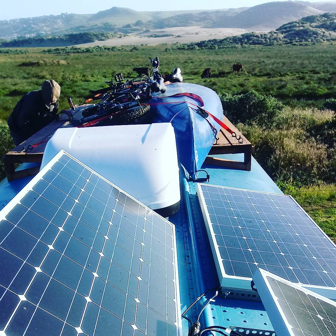 solar panels on top of a skoolie bus build