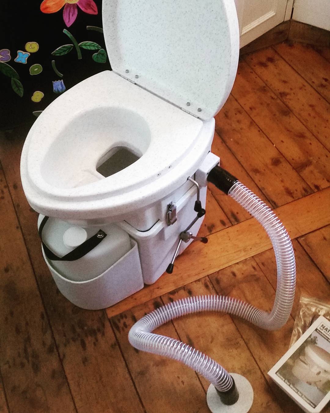 Installing a portable composting toilet in a conversion van bathroom