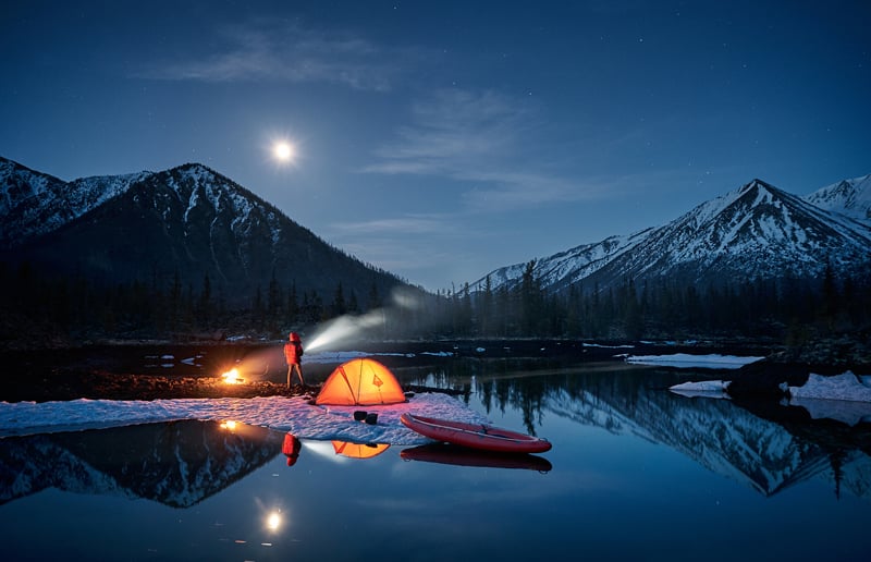 Camping in the mountains at night in the winter
